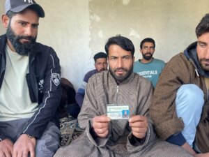 Ajaz-Ahmad-Mughal-holding-the-identy-card-of-his-brother-Rashid-ahmad-1777381707.jpeg