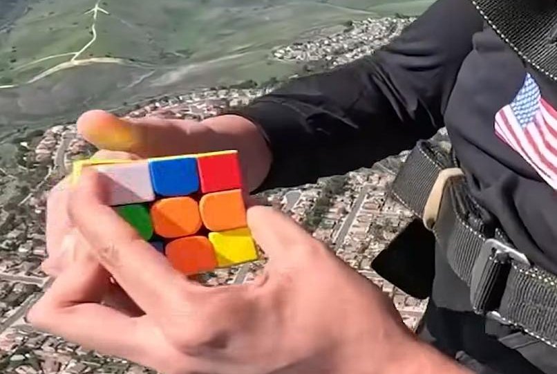 Man-solves-two-Rubiks-cubes-while-skydiving-to-break-world-record.jpg