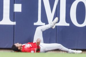 Reds-Dane-Myers-avoids-broken-bones-from-wall-collision.jpg