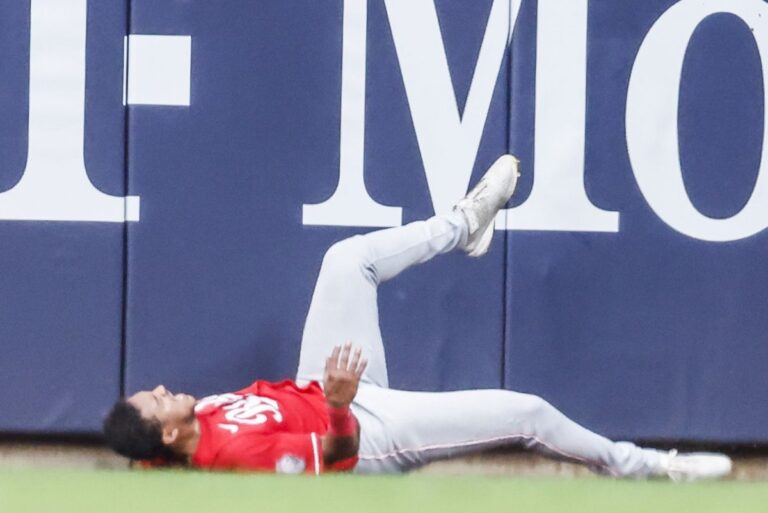 Reds-Dane-Myers-avoids-broken-bones-from-wall-collision.jpg