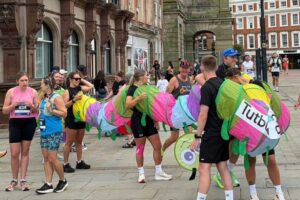 10-people-run-half-marathon-in-caterpillar-costume-chase-world-record.jpg