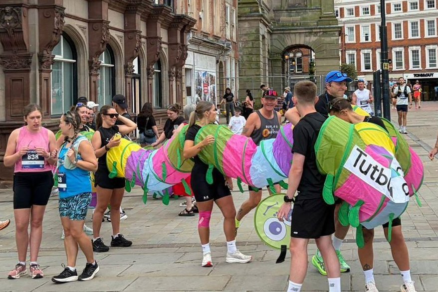 10-people-run-half-marathon-in-caterpillar-costume-chase-world-record.jpg